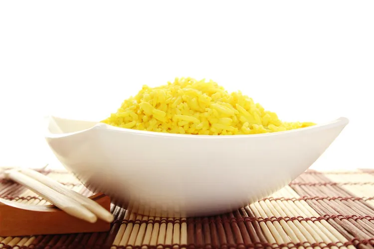 Turmeric and cumin-infused yellow jasmine rice with garlic and butter