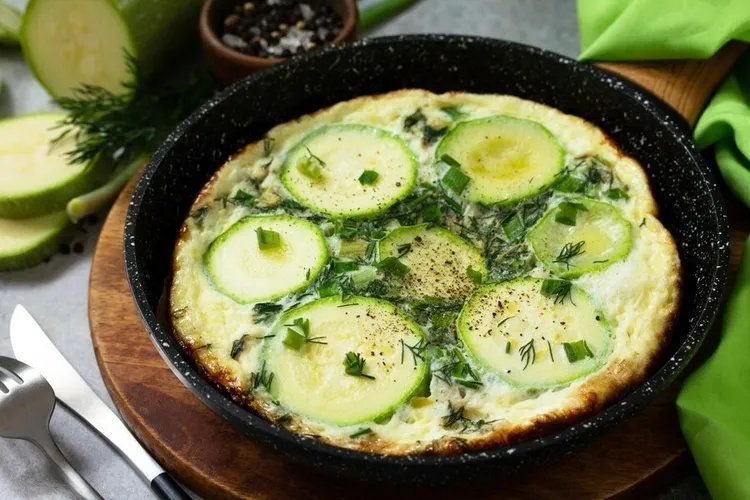 Zucchini frittata with onion and cheddar cheese