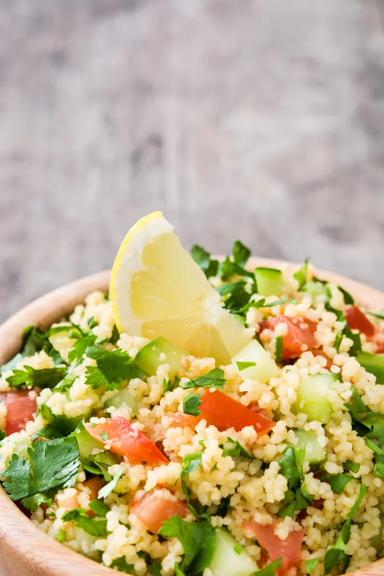 Pearl couscous salad with lemon, asparagus and tomato