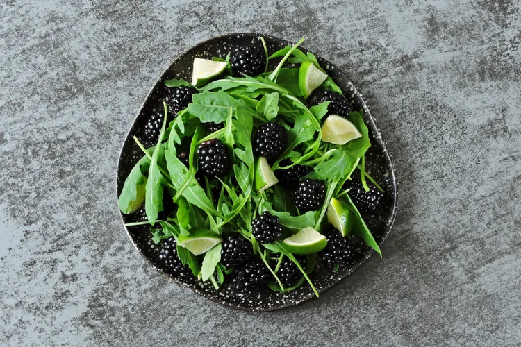 Fresh spinach salad with blackberries, onions and lemon vinaigrette