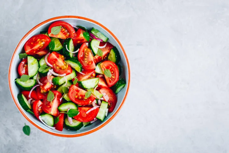 Tomato and cucumber salad with red onion and vinegar