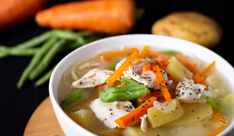 Aromatic fish and vegetable soup with noodles
