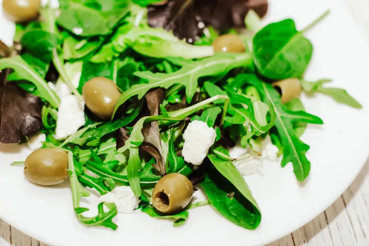 Bean and rocket salad with green-olive dressing