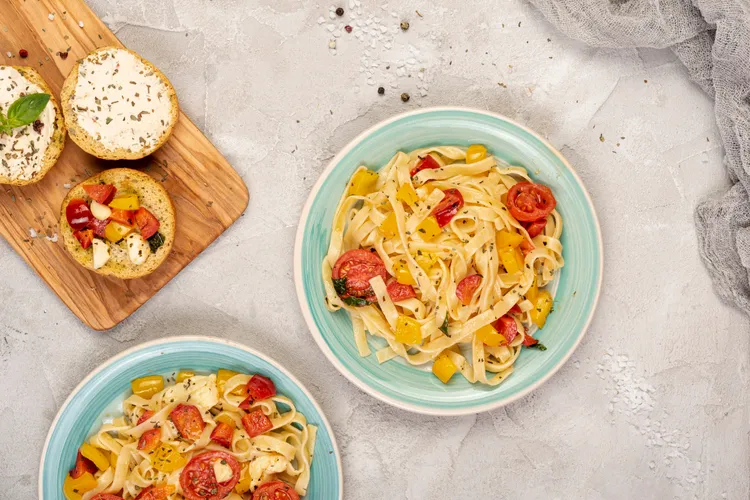 Linguine with red, yellow and orange tomatoes