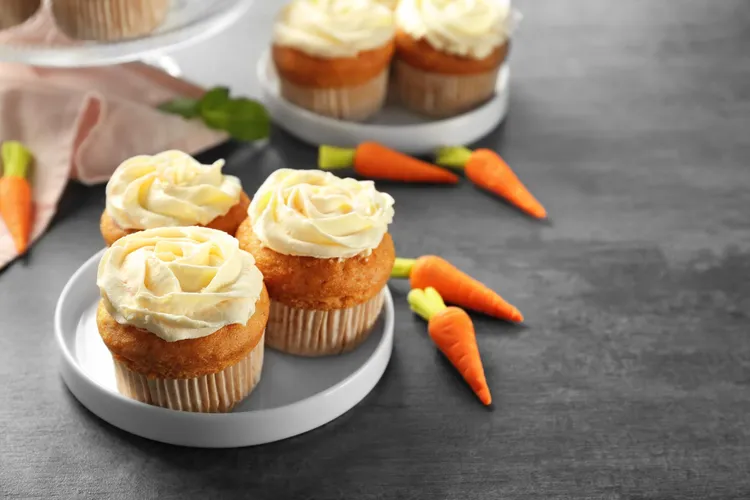 Banana, carrot and pecan muffins with orange icing