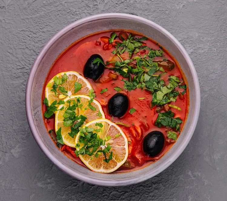 Tomato soup with olive & caper pistou
