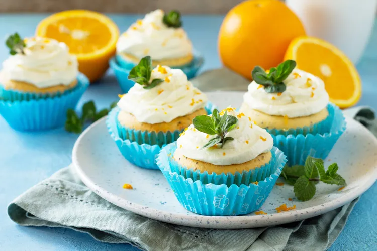 Orange and poppy seed muffins with cream cheese icing