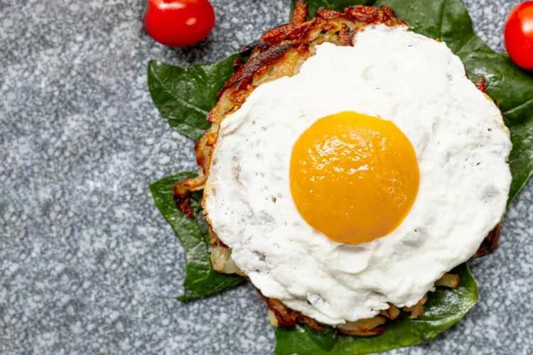 Potato cakes with fried egg and hollandaise