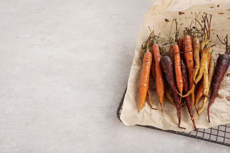 Roasted rainbow carrots with pea hummus