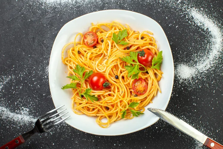 Roasted tomato and chilli pasta with parsley salad