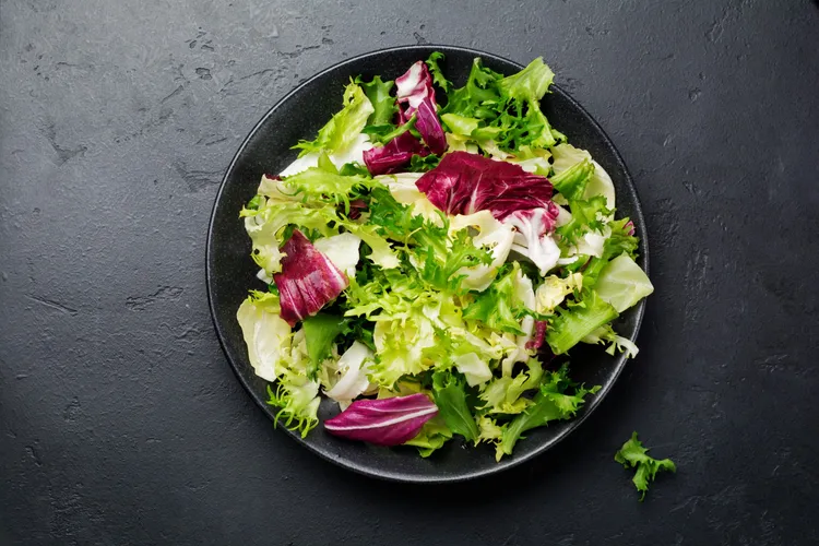 Mixed green salad with olive dressing