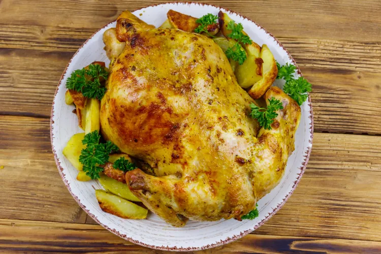 Garlic and rosemary butter pot roast chicken