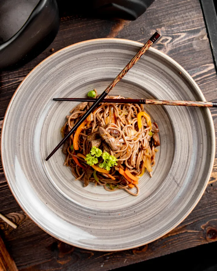 Roast pork fillets with coriander udon noodles