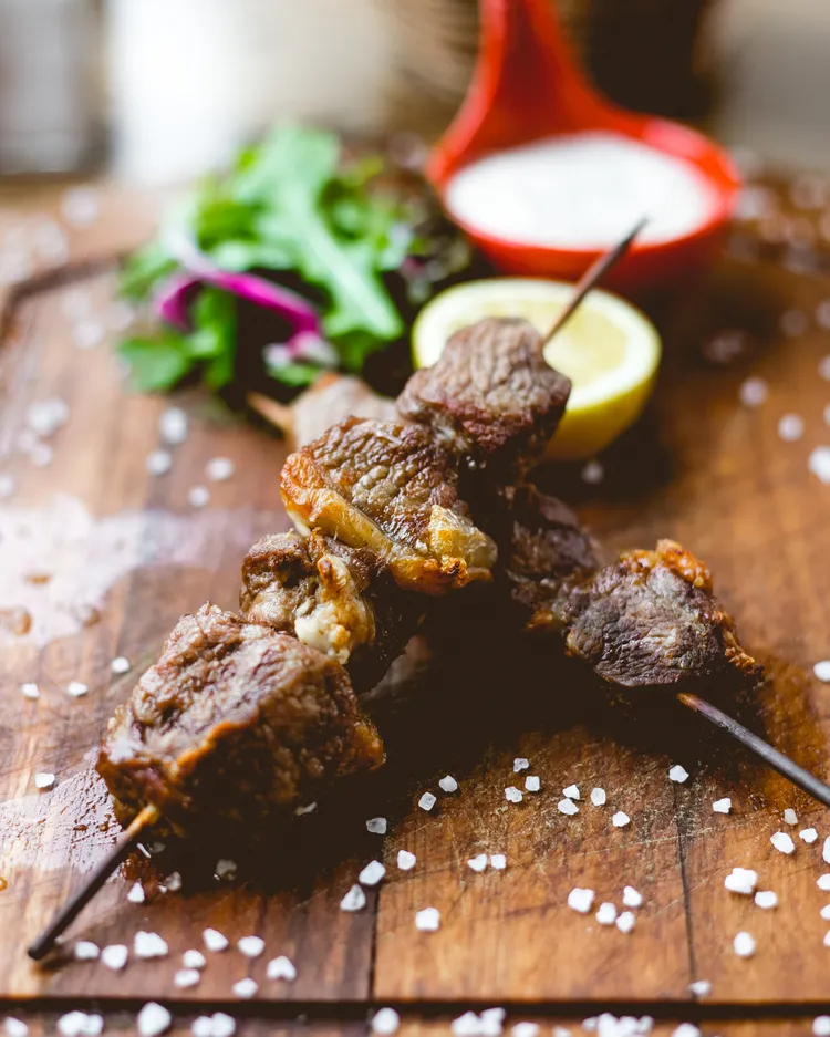 Spiced beef skewers with carrot salad