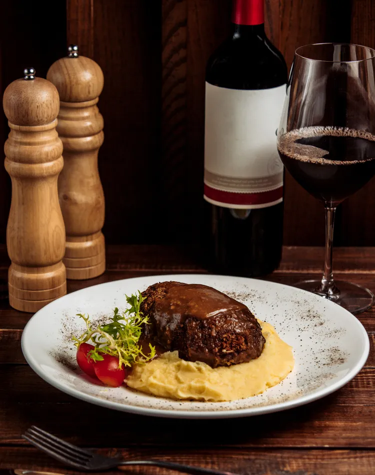 Classic red wine-marinated steak with creamy mash