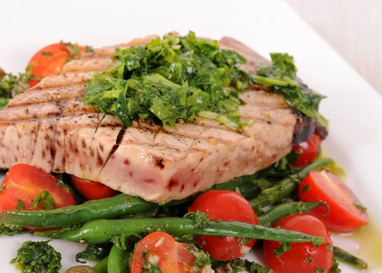 Lemon fish with sauteed beans and tomatoes
