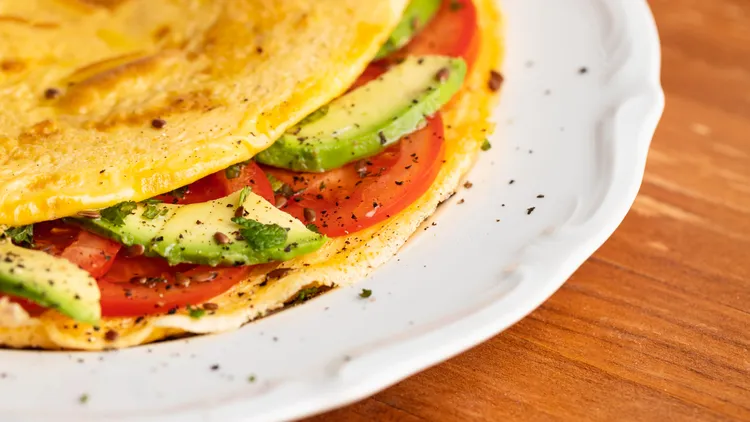 Tomato, cheese and avocado omelette