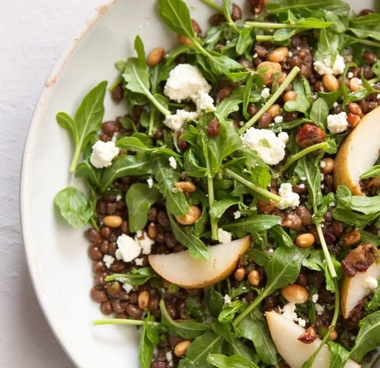 Warm lentil salad with hazelnuts, pear, feta and arugula