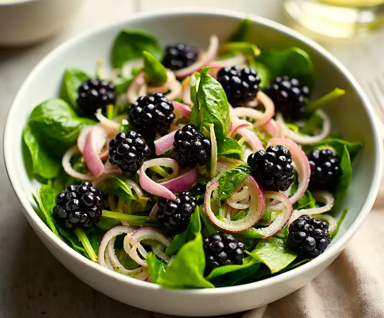 Spinach salad with blackberries, onions and lemon vinaigrette