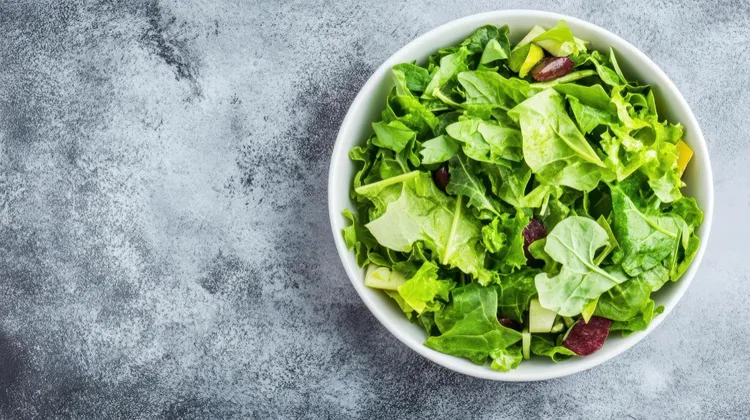 Mixed green salad with olive dressing