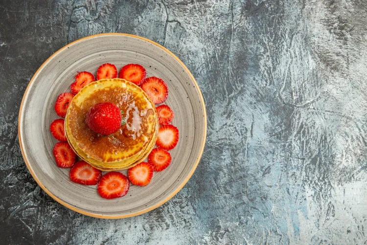 Pancakes with maple syrup butter & strawberries