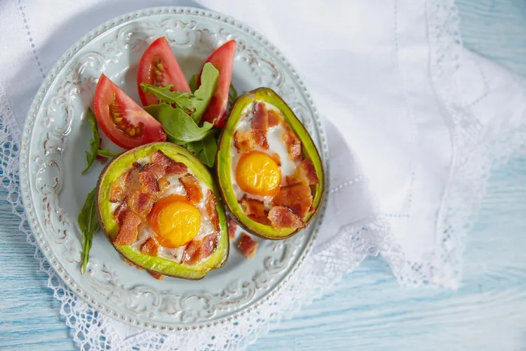 Bacon stuffed avocado baked eggs