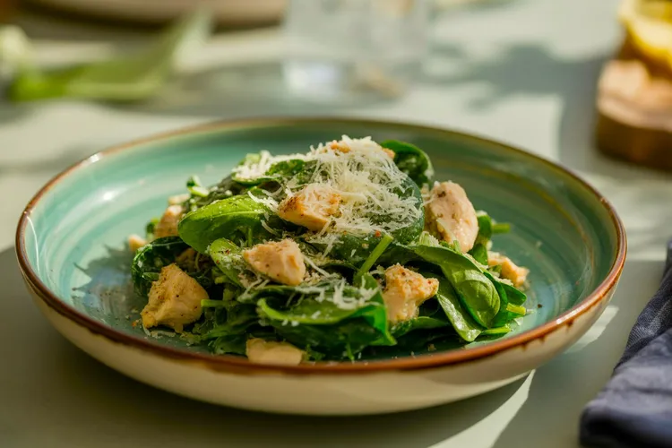 Grilled chicken caesar salad with spinach and parmesan