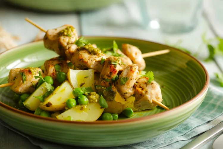 Herbed chicken skewers with pea pesto potato salad